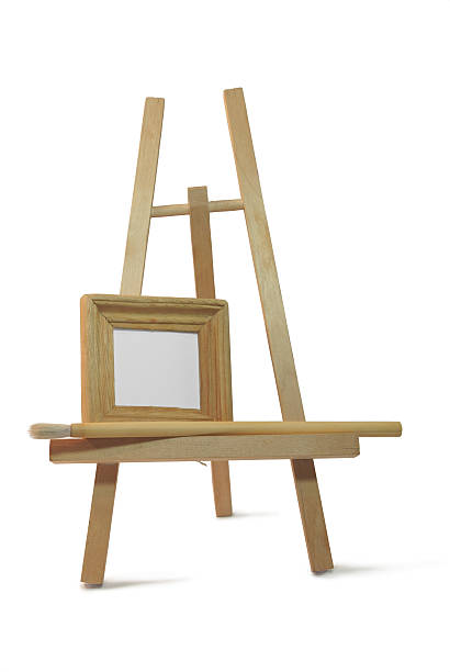 small wooden empty frame on easel stock photo