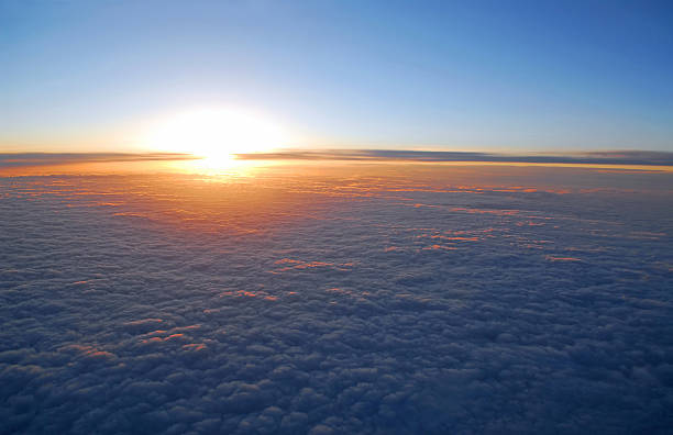 istock Sun rising on blue skies above the clouds 92279876