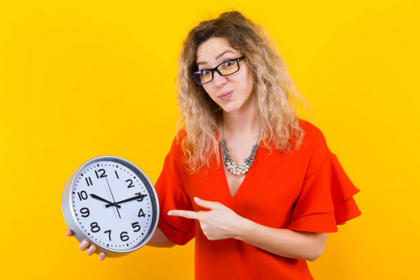 istock Woman in dress with clocks 922798842