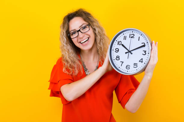 istock Woman in dress with clocks 922798848