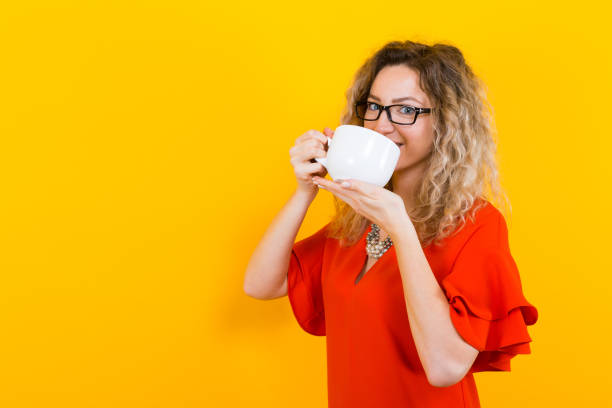 istock Woman in dress with cup 922798902