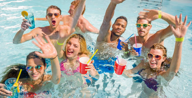 istock Friends enjoying in swimming pool 922799078