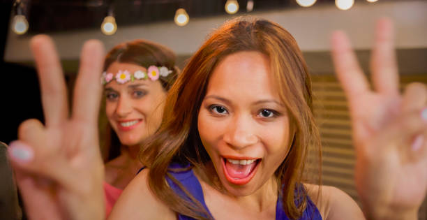 istock Women dancing at party 922799242