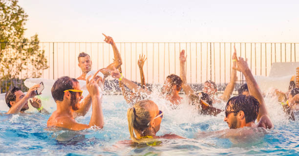 istock Friends enjoying in swimming pool 922800944