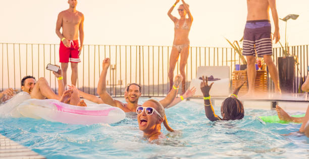 istock Friends enjoying in swimming pool 922801262