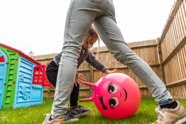 istock Mother having fun with daughter on the backyard 922801964