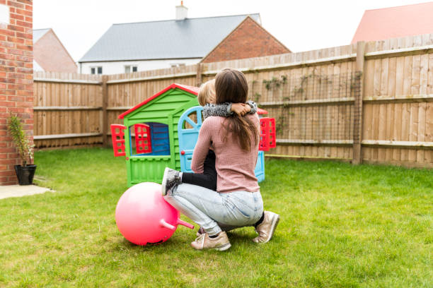 istock Mother having fun with daughter on the backyard 922801968
