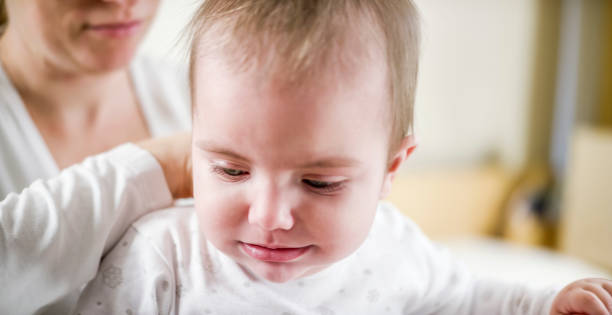 istock Mother checking baby's temperature with her hand 922802722