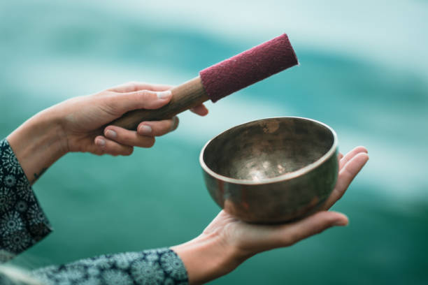 istock Cropped Image Of Hands Playing Singing Bowl 922803138