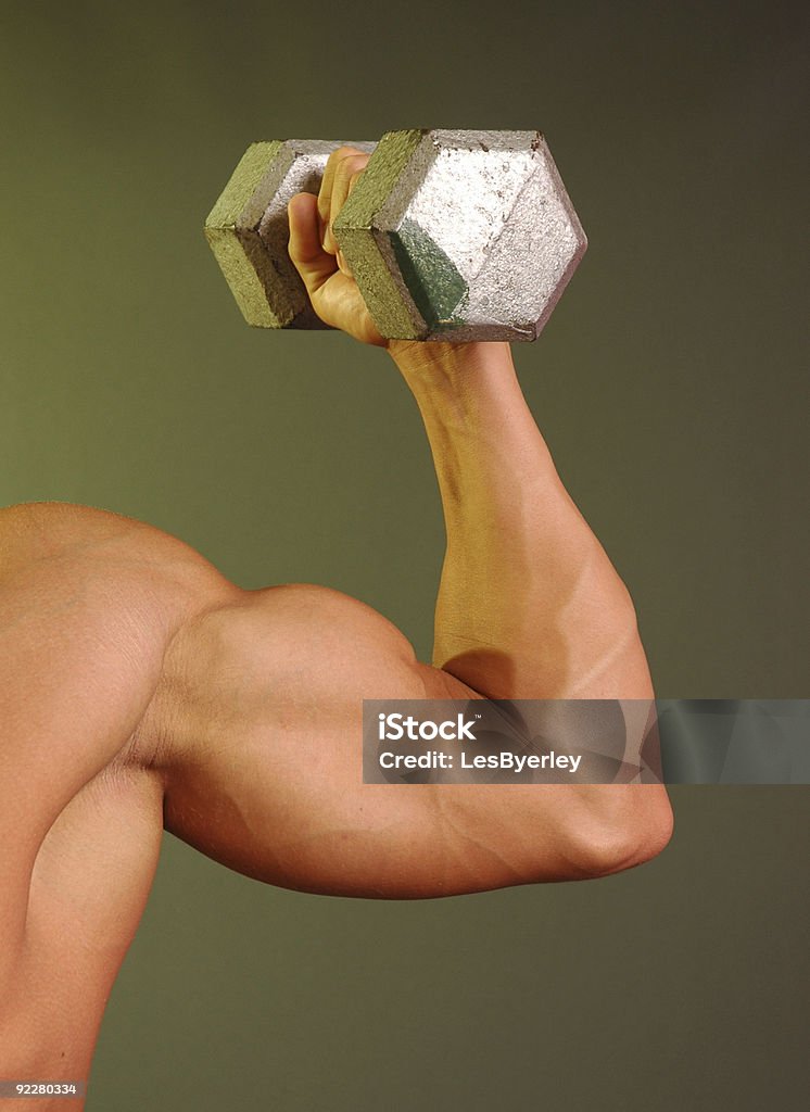 muscled arm holding 20 Pfund Gewicht - Lizenzfrei Bizeps Stock-Foto