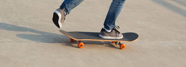 istock skateboarder legs skateboarding at skatepark 922803972