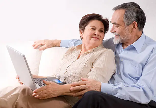 Photo of Senior couple on laptop