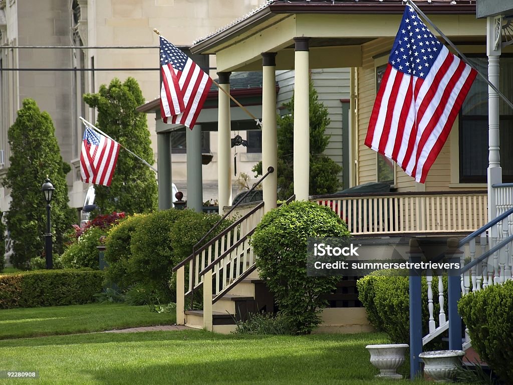 American flags flying from front porches  House Stock Photo