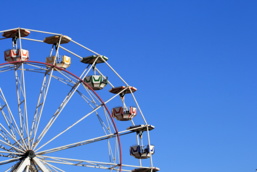 Ferris wheel at evening blue sky