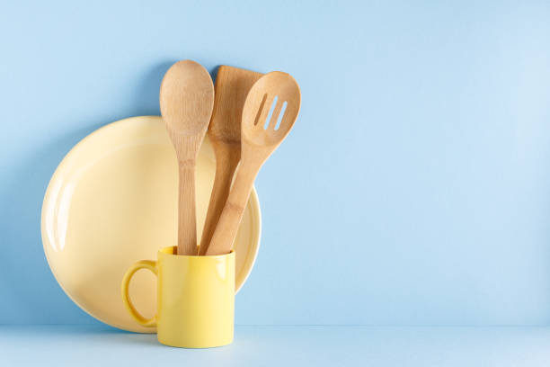 Crockery and cutlery on a blue pastel background