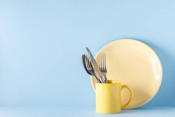istock Crockery and cutlery on a blue pastel background 922810016