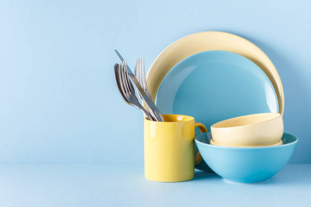istock Crockery and cutlery on a blue pastel background 922810022