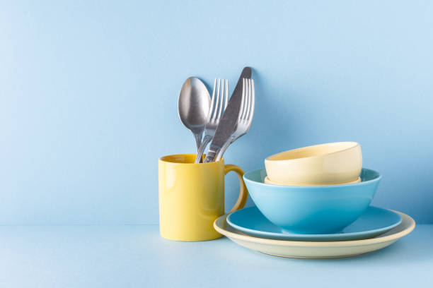 istock Crockery and cutlery on a blue pastel background 922810108