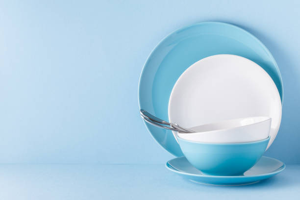 istock Crockery and cutlery on a blue pastel background 922810136