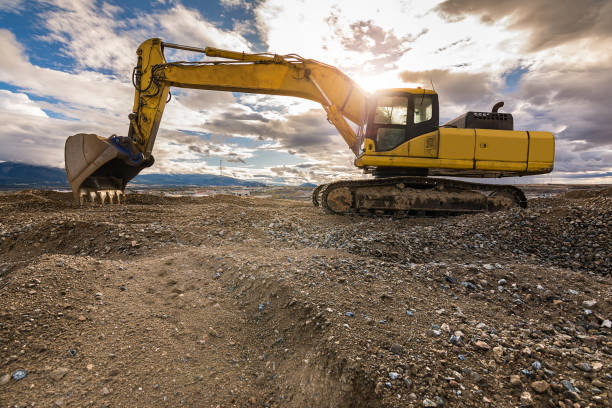 istock Outdoor quarry with heavy machinery 922814344
