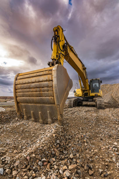 istock Outdoor quarry with heavy machinery 922814414