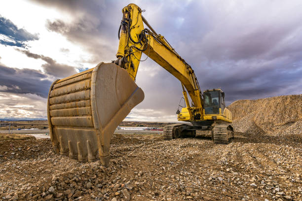 istock Outdoor quarry with heavy machinery 922814430