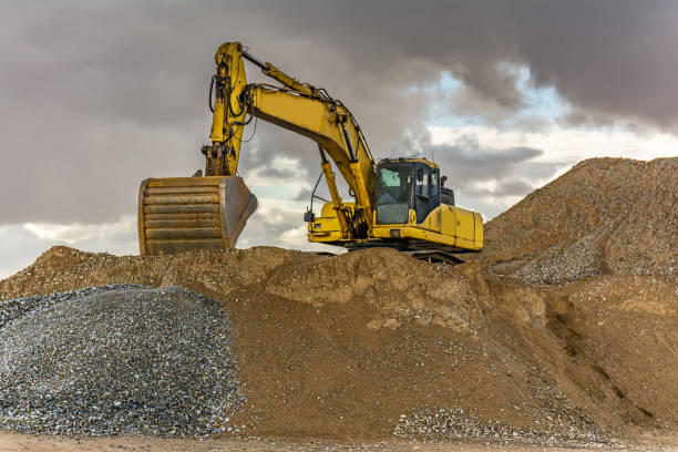 istock Outdoor quarry with heavy machinery 922814490