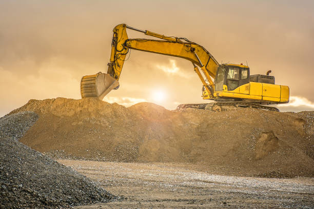 istock Outdoor quarry with heavy machinery 922814552