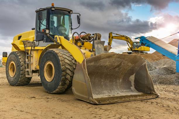 istock Outdoor quarry with heavy machinery 922814588