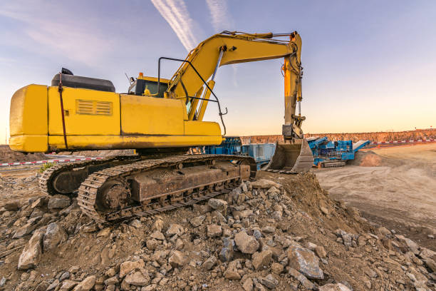 istock Outdoor quarry with heavy machinery 922815392