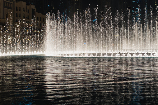 Night fountain, beautiful streams of water, light and music.