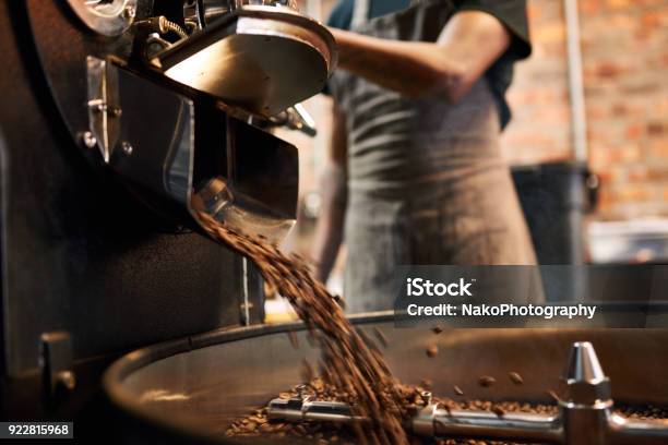 Coffee Beans Being Poured Out Of A Coffee Roasting Machine Stock Photo - Download Image Now