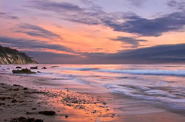 Photo of Santa Barbara foamy seashore at sunset