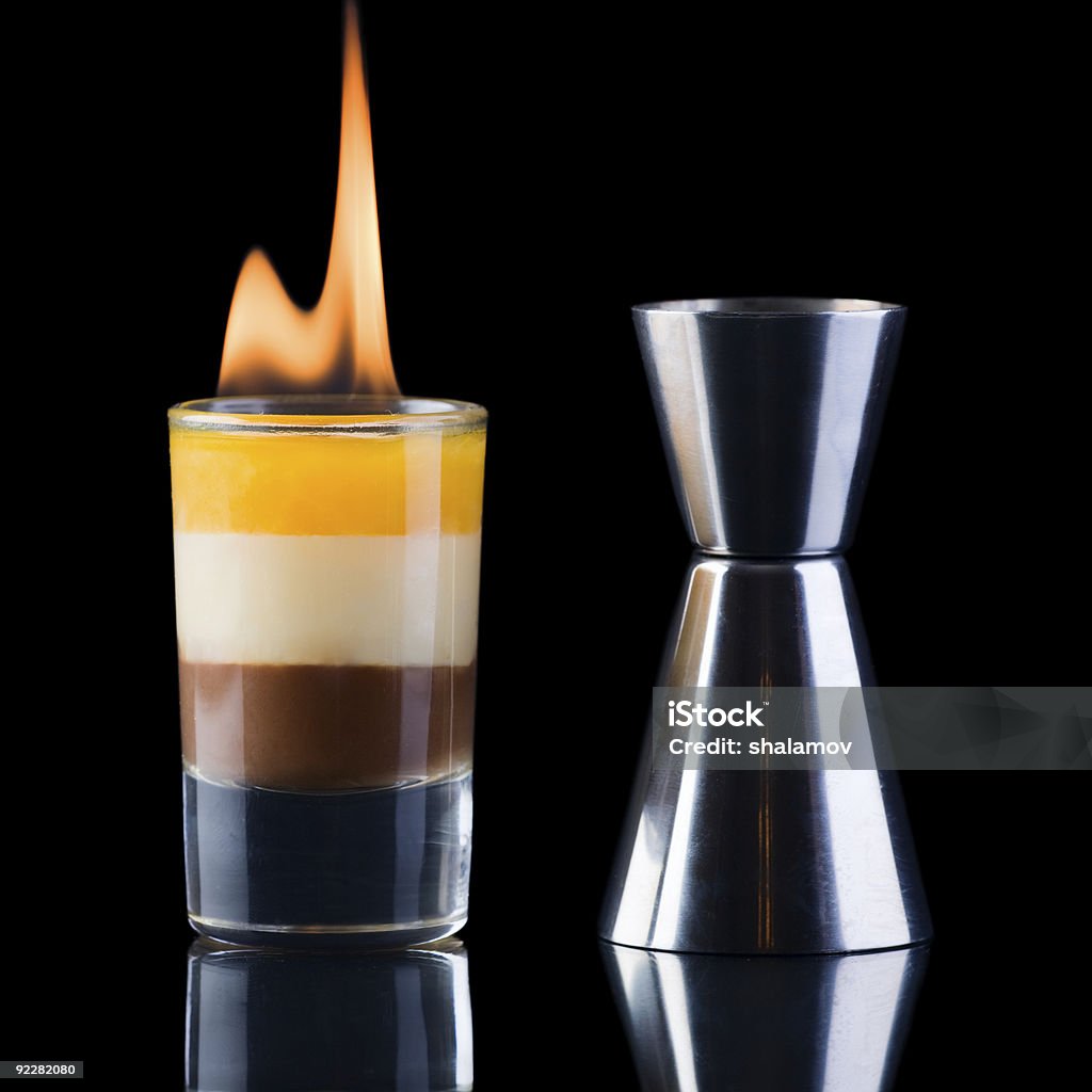 B-52 Shot and measure glass over black background  Alcohol - Drink Stock Photo