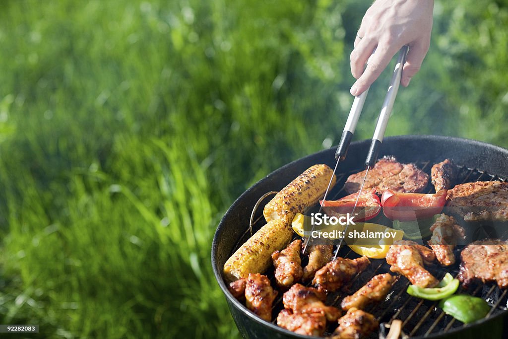 Fresh meat and vegetables on outdoor grill  Barbecue Grill Stock Photo