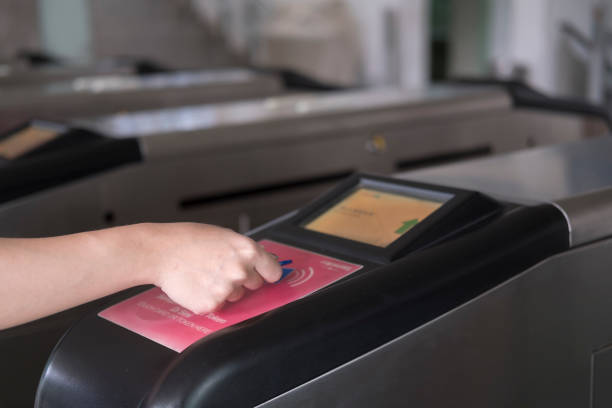 istock Hand inserts entrance chip in monorail station 922825330