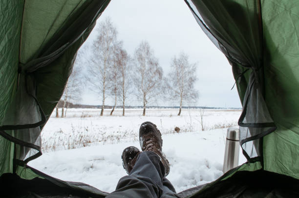 istock View from the inside of the tent, broken into the winter. 922826618