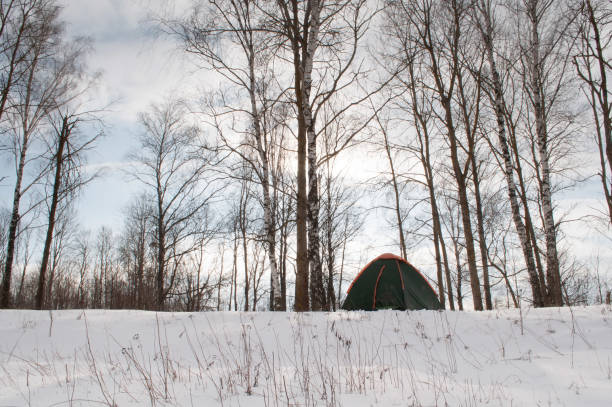 Tent in the snow, camping in winter, travel on winter vacation