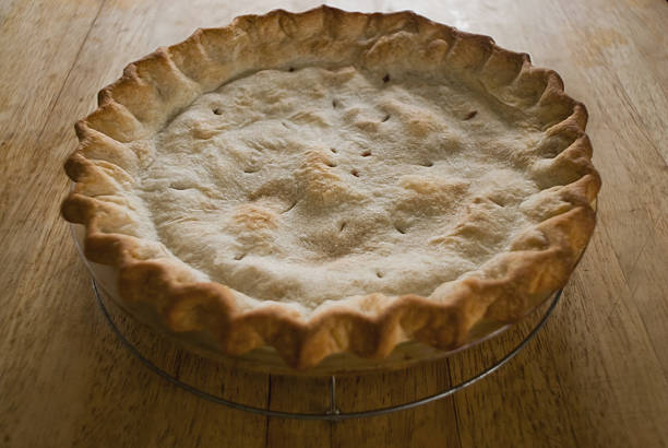 Apple Pie Cooling on a Table Top stock photo