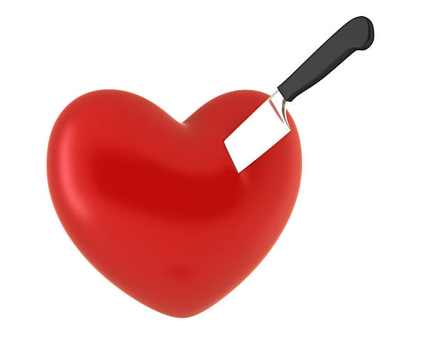 Red heart with knife stock photo