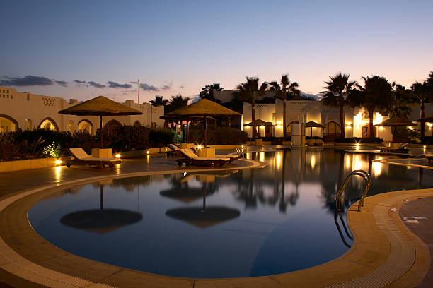 istock swimming pool with in tropical resort 92283402