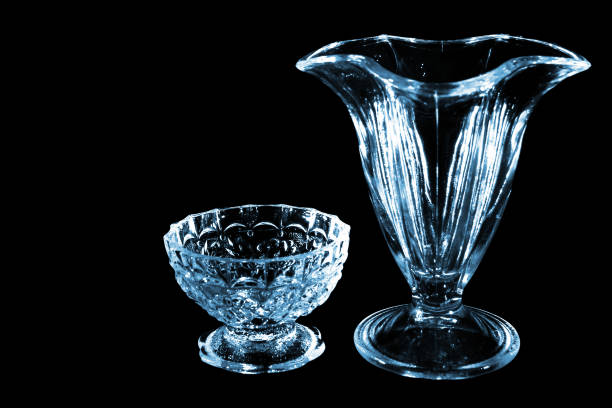 istock Small glass and vase isolated on black background 922835552
