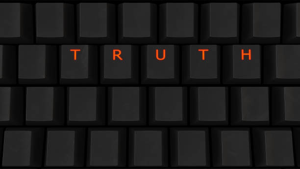 istock Close Up of Illuminated Glowing Keys on a Black Keyboard Spelling Truth 922836072