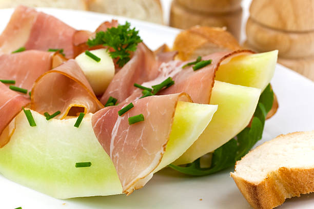 istock Prosciutto di Parma ham and three slice of melon 92283658
