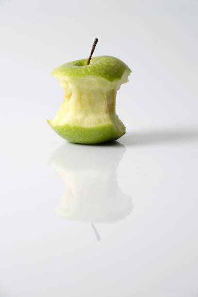 istock Close-Up On Eaten Granny Smith Apple Against White Background 922842680
