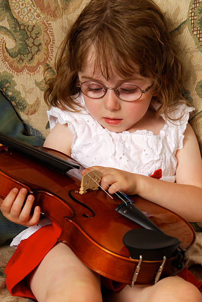 istock Girl with a violin 92284290