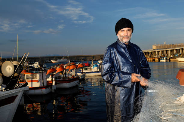 fisherman working in the fishing port - fishing nautical vessel small men imagens e fotografias de stock