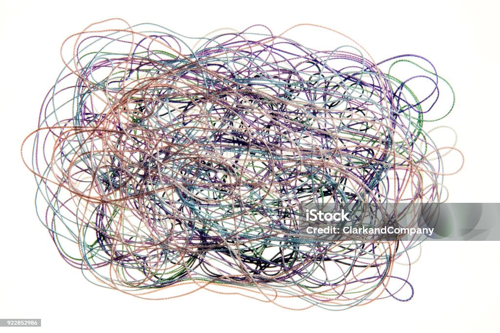 Chaos Concept trying to illustrate chaos and mess. Using a mess of threads tangled and mixed up. Colour, horizontal with some copy space. Chaos Stock Photo