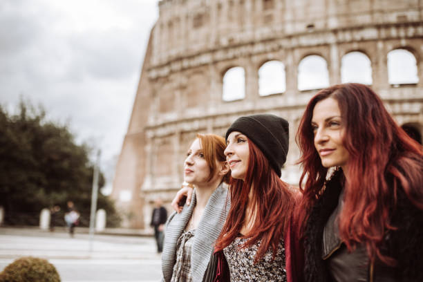 istock tourists in rome take walking under the coliseum 922854938