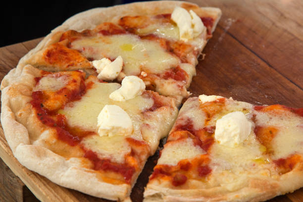 istock Pizza on wooden background 922855054